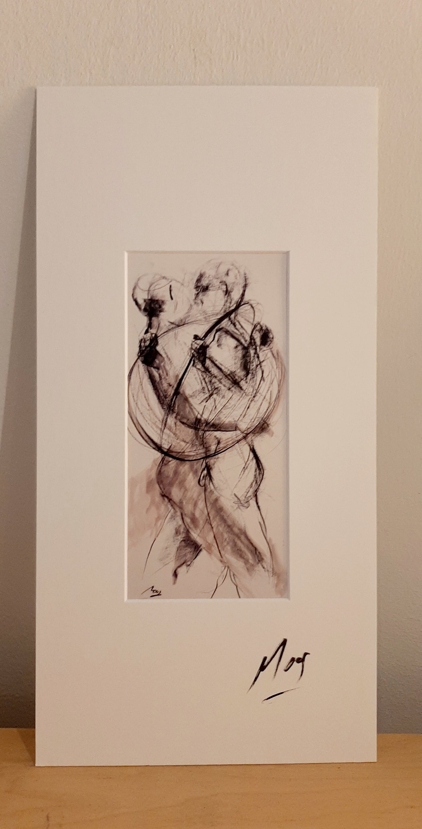 Ein wunderschönes Bild mit einem besonderes Passepartout handsigniert gerahmt.Es zeigt zwei Tänzer im Tango vereint